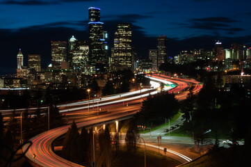 Fototapeta na wymiar Long exposure shot of night traffic at Interstate 5 in front of Seattle downtown from the Dr. Jose Rizal Park, Seattle, USA