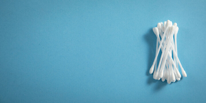 Cotton Buds Or Swabs For Ear Cleaning On The Blue Background.