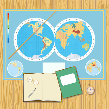 World map on a wooden table with notepad, book, compass, glasses, pointer. Travel preparation.
