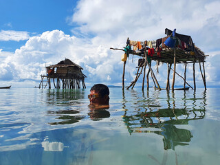 Bajau laut or sea gypsy fishermen near stilt house in Maiga island Semporna Sabah Malaysia