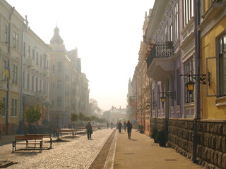 The morning fog on the main street of the Chernivtsi