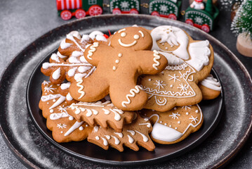 Gingerbread, Christmas tree decorations, dried citrus fruits on a gray concrete background