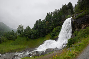 Water from the Fosselva river drops down the 50 m high powerful Steindalsfossen, Norway