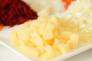 Close-up of chopped potatoes for making traditional Ukrainian borscht.