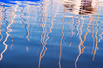reflet des mâts sur le lac de Genève