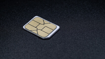 sim card for mobile phone on black background - obrazy, fototapety, plakaty