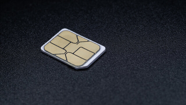 sim card for mobile phone on black background