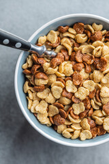 Breakfast cereal flakes in bowl.