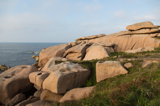 Extraordinarily beautifully colored stones and fantastically shaped rock formations weathered by centuries of wind and tide at the Atlantic Ocean-the pink granite coast in Brittany, France