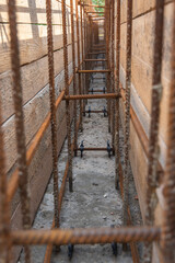 Tied rebar and mounted formwork close-up, view inside the trench