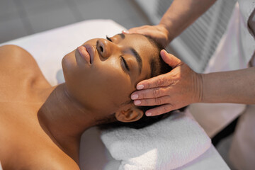 african woman in yellow towel on facial massage	
