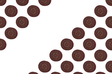 Pattern of chocolate cookies. chocolate Cookies on a white background. Flat lay. Sweet cookies flat lay pattern on light pink background. Top view...