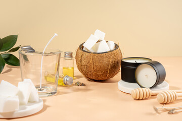 Set for homemade natural eco-friendly coconut wax candles, wick, perfume, aroma oil. Candle making utensils.Trendy diy candles to health on beige background.Copy space.Cruelty-free vegan product.