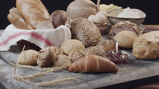 Different types of fresh baked Dutch bread is on the wooden table
