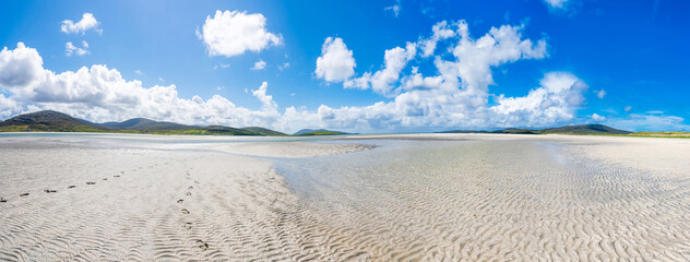 Wide panoramic view of Luskentyre Sands beach on the Isle of Harris, Scotland, UK