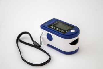 A blue pulse oximeter on the isolated white background