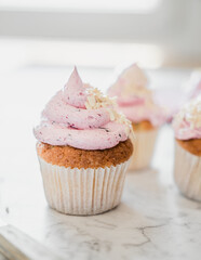 cupcakes with whipped butter cream blackberry strawberry lemon cake