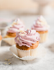 cupcakes with whipped butter cream blackberry strawberry lemon cake