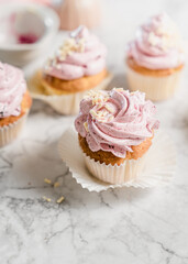 cupcakes with whipped butter cream blackberry strawberry lemon cake