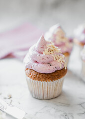 cupcakes with whipped butter cream blackberry strawberry lemon cake