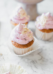 cupcakes with whipped butter cream blackberry strawberry lemon cake