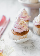 cupcakes with whipped butter cream blackberry strawberry lemon cake