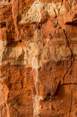 Sedimentary rocks with a high content of iron oxide. Red soil, loam. The texture of the soil.