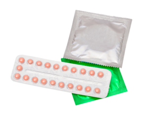 Oral contraceptive pill  and condom isolated on white background