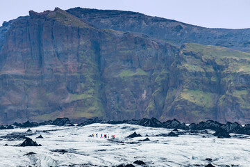View of people hike tour through Myrdalsjokull Glacier