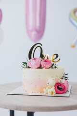 Beautiful delicious birthday cake with white and pink cream. Fresh dessert biscuit