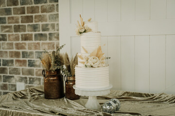 wedding cake with pampas and floral boho themed white