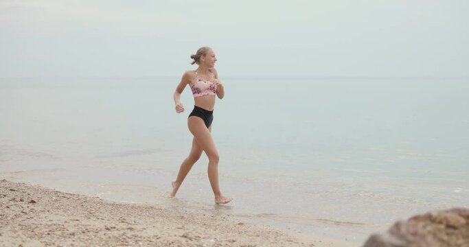 Teen Girl Running On The Beach