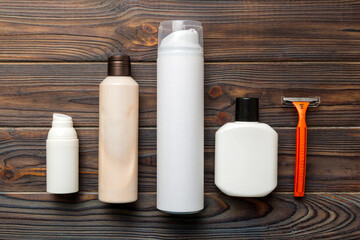 shaving man set. shaving machine, towel, lotion and shaving foam on colored background. Men bath Accessories top view