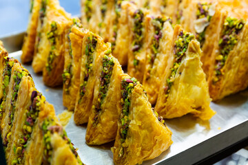 Baklava from filo pastry sweetened with honey and filled with chopped walnuts and pistachios....