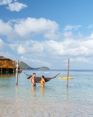 Couple on the beach of the tropical Island Saint Lucia or St Lucia Caribbean, holiday vacation. men...
