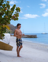 young men in a swim short on vacation in Saint Lucia, luxury holiday Saint Lucia Caribbean, men on...