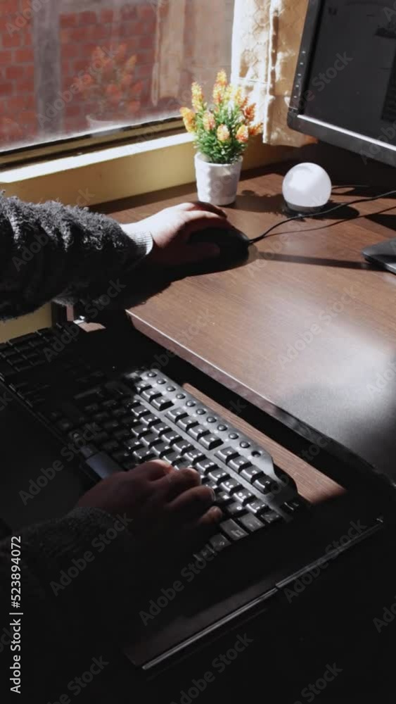 Poster vertical view of human hands typing on keyboard and clicking mouse
