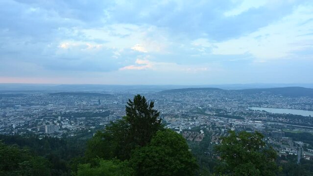 Time lapse of city buildings in downtown Zurich Switzerland  taken from top of Uetliberg mountain.