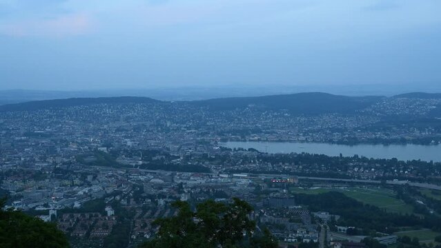 Time lapse of city buildings in downtown Zurich Switzerland taken from top of Uetliberg mountain.