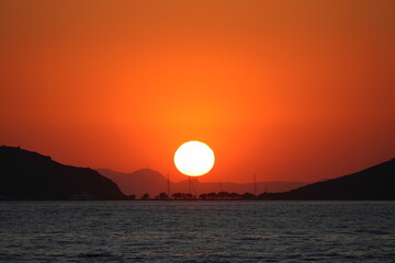 sunset on the beach. Seaside town of Turgutreis and spectacular sunsets. Selective Focus.