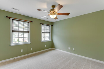 empty room with a window green wall traditional light fixture