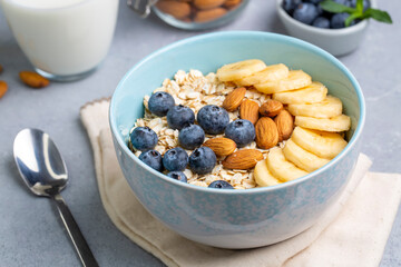 Oatmeal. With banana, blueberry and almond for healthy breakfast or lunch. Healthy diet nutrition.