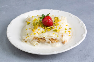 Close-up walnut gullac dessert. Traditional Ramadan dessert. Middle Eastern desserts.