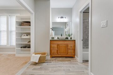 Interior modern bathroom wood vanity built in closet white sink bowl