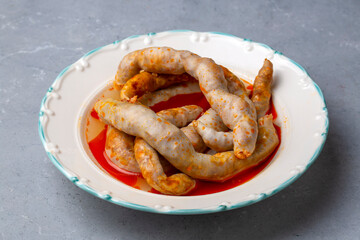 Traditional delicious Turkish cuisine, Middle Eastern dishes, offal dishes, stuffed sheep intestines (Turkish name; Mumbar dolmasi)