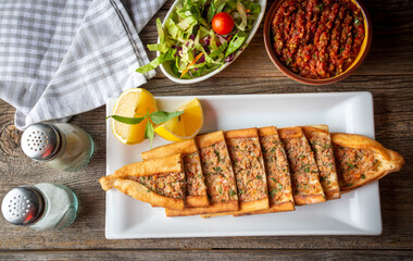 Turkish pide with minced meat, Turkish name; Kiymali Pide. Traditional Turkish cuisine. Turkish pizza Pita with meat.