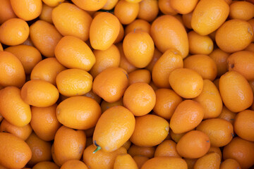 Appetizing Tropical Kumquat Fruit Background.