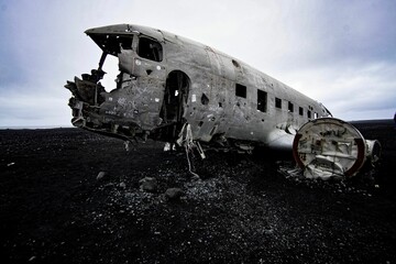 View of an old, crashed plane on a cloudy day