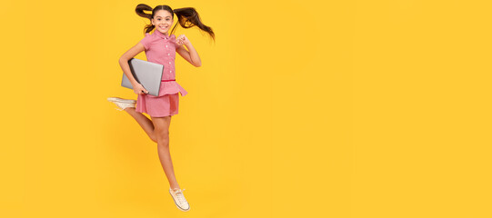 happy child girl hurry up running hold notebook to find sale and discount, energy. School girl portrait with laptop, horizontal poster. Banner header with copy space.