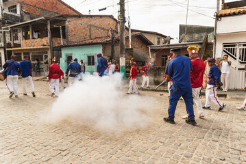 Members of the Marujada cultural event stage a sword fight between Moors and Christians